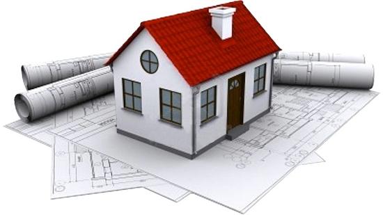 Casa en forma de maqueta donde se pueden apreciar los papeles de la posible distribución de la casa